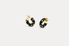 Gold-tone hoop earrings with black enamel and blue zirconia accents, round design.