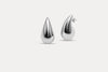Silver teardrop stud earrings with sculpted glossy drop silhouette