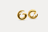 Gold wave hoop earrings pair with curved spiral shape