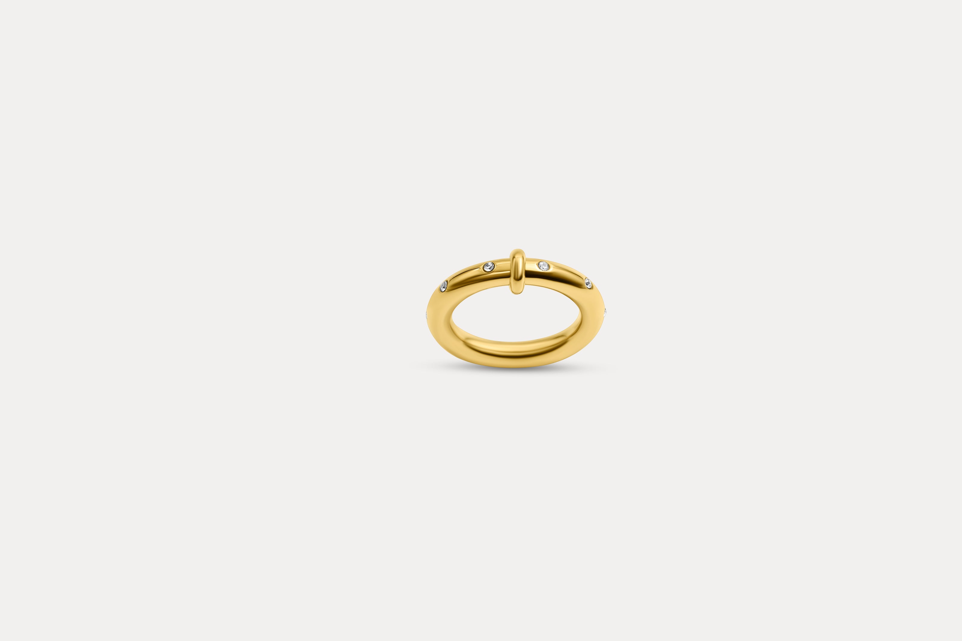 Gold crystal loop ring with small central stone, thin open oval band