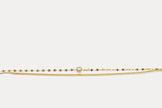 Gold double chain bracelet with round gemstone on fine linked band