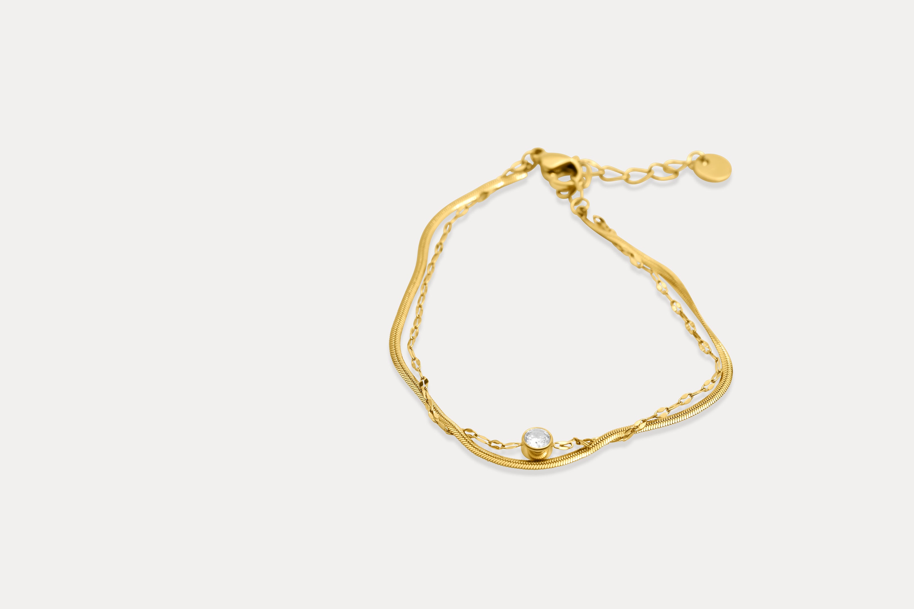 Gold double chain bracelet, pear-shaped link design with tiny center bead