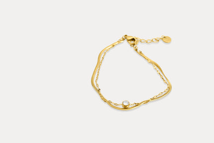 Gold double chain bracelet, pear-shaped link design with tiny center bead