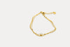 Gold double chain bracelet, pear-shaped link design with tiny center bead