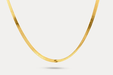 Snake chain necklace in gold-tone metal links, shown laid out