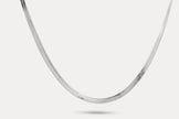 Snake chain necklace in silver-tone metal links, shown laid out