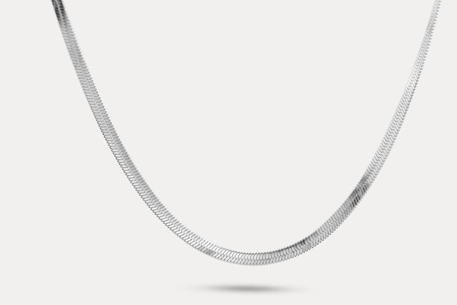 Snake chain necklace in silver-tone metal links, shown laid out