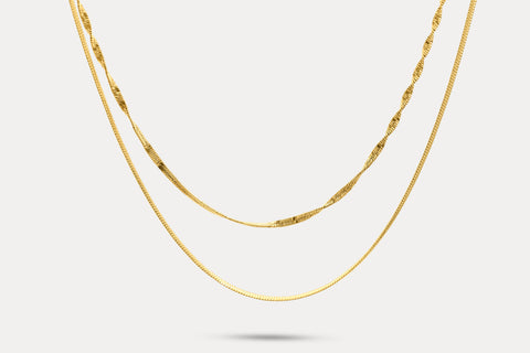 Gold double-layer chain necklace with fine links and curved front