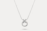 Circle pendant necklace with silver-tone round charm and linked X detail