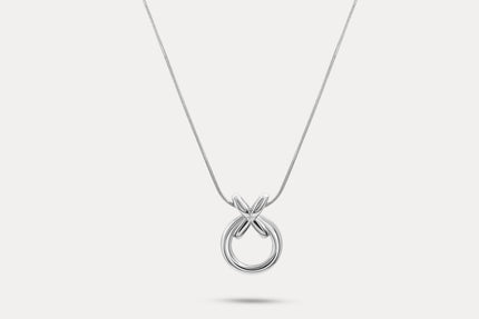 Circle pendant necklace with silver-tone round charm and linked X detail