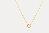 Gold pearl frame necklace with circular pendant on a fine chain
