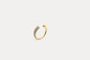 Gold crystal curve ring with pavé stones along the inner edge