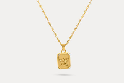 Gold-tone angel tag necklace with square pendant featuring angel relief