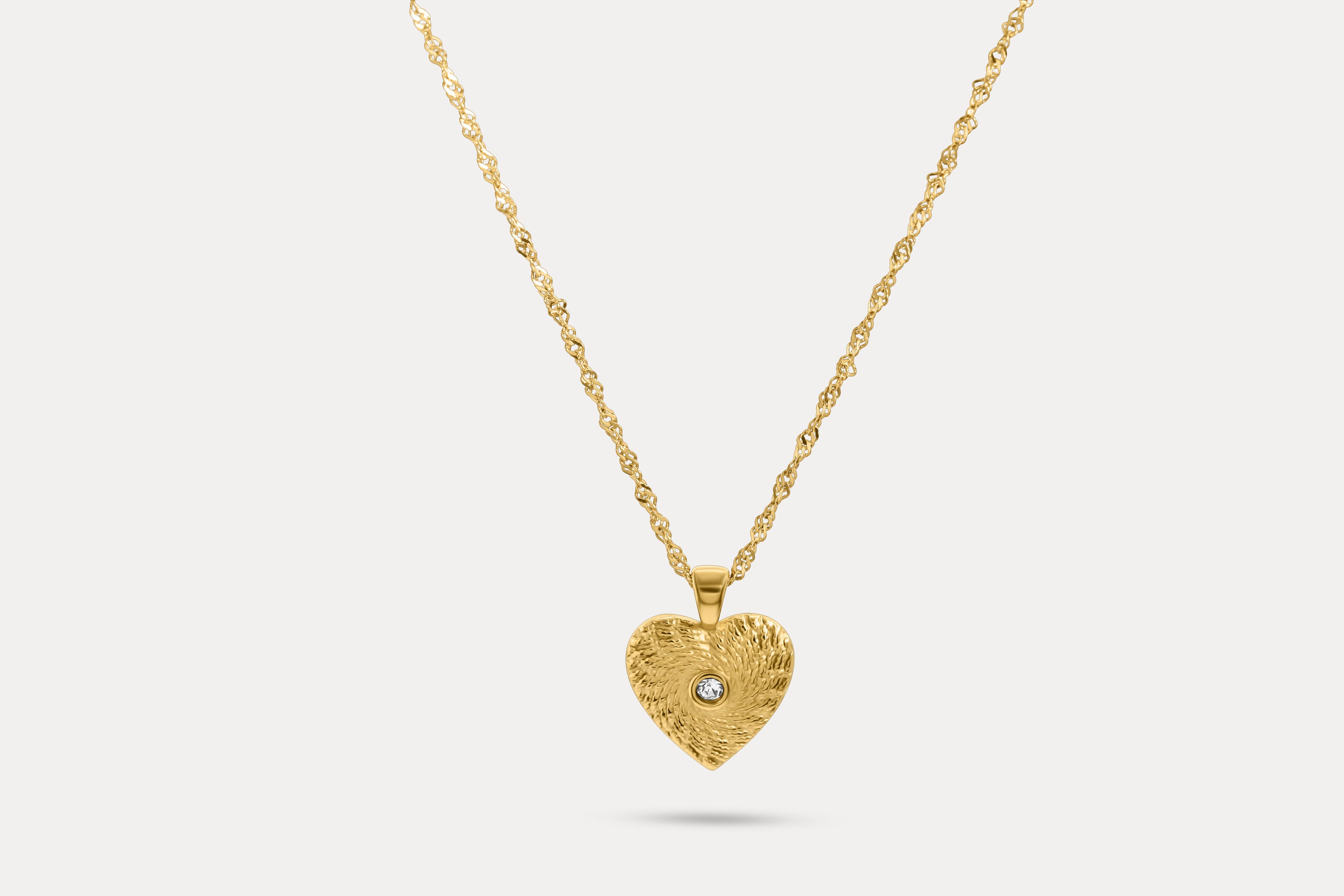 Gold chain heart pendant necklace with round blue gemstone