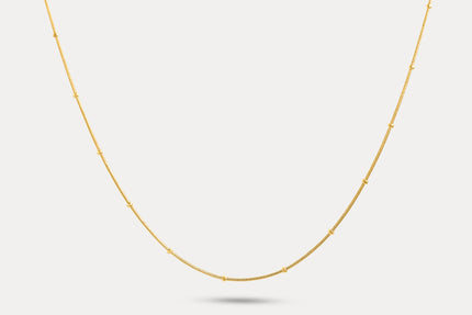 Gold thin chain necklace with small bead-like segments