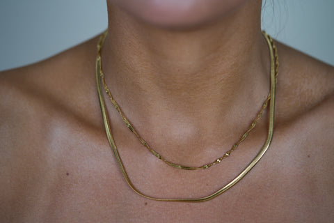 Gold layered chain necklace with two curved chain strands