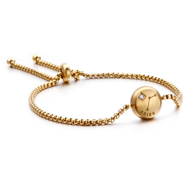 Gold zodiac charm bracelet with Aries round pendant and small crystal detail